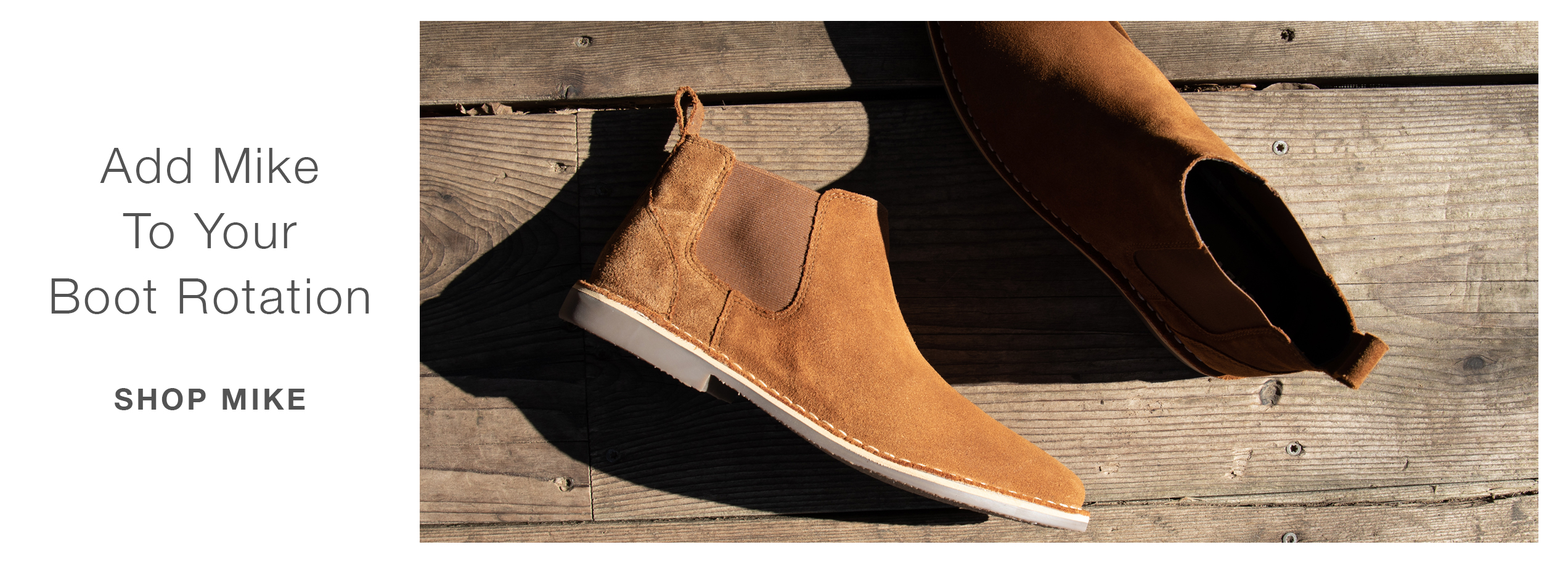 Photo of Mike our newest style in chestnut on a wood background. Copy says Add Mike to your boot rotation. Shop Mike.